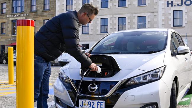 Anton Vikstrom, co-founder of The Good Car Company, charges an electric vehicle and hopes to bring his bulk-buy program to Northern Rivers residents. Supplied: TasPorts