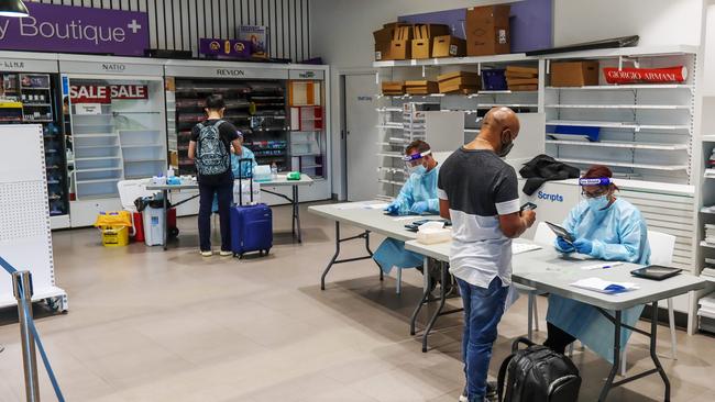 Passengers arriving from Sydney get tested for COVID-19 at Melbourne Airport. Picture: Tim Carrafa