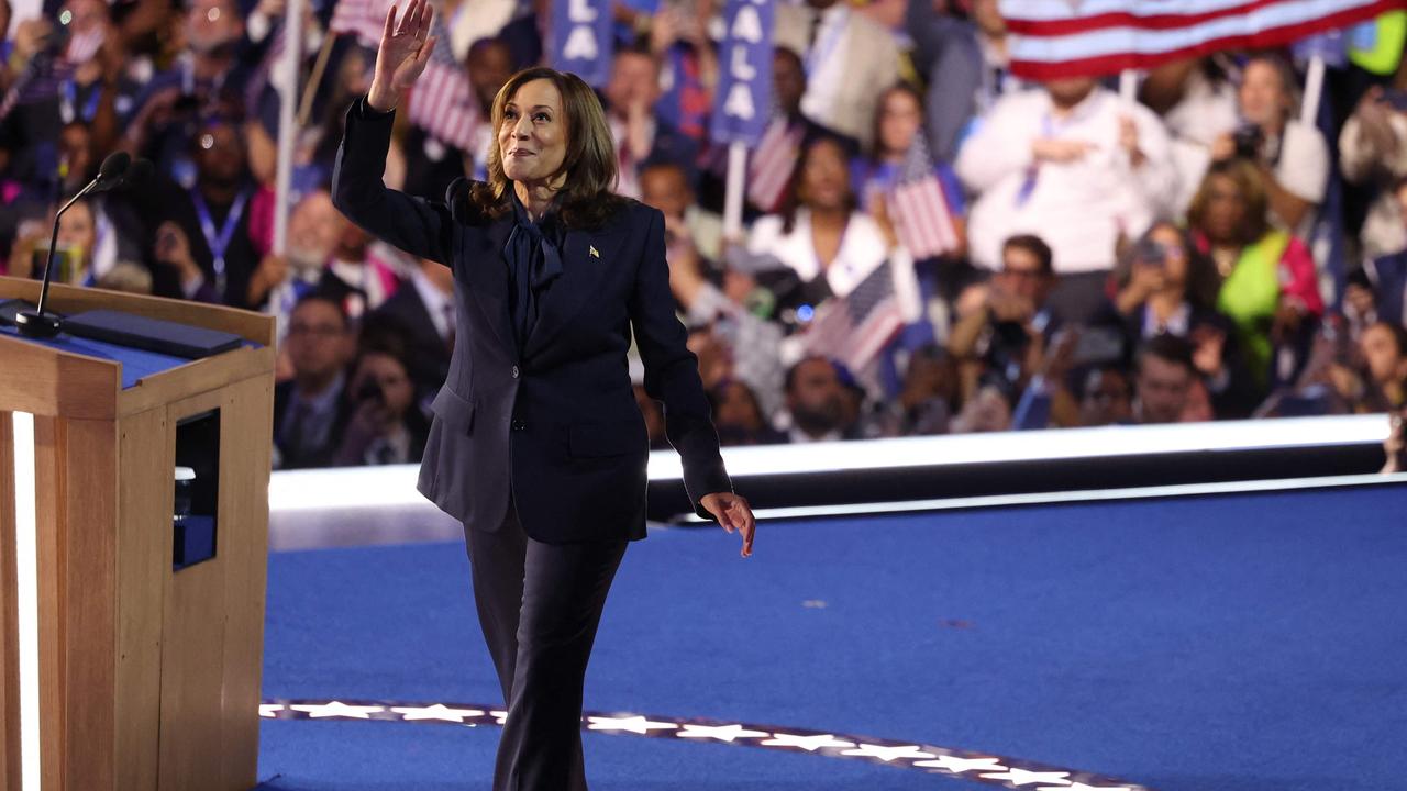 Kamala Harris waves as she leaves the stage. Picture: AFP.