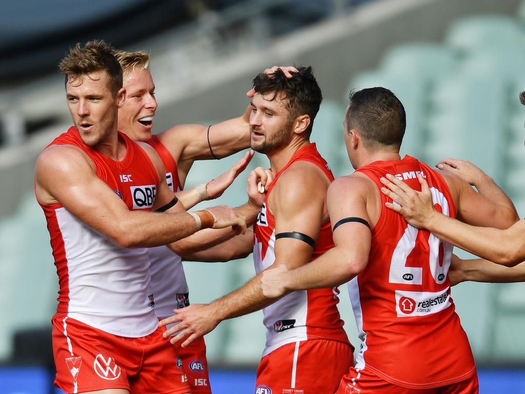 Swans players congratulate Sam Gray on his first goal for the club