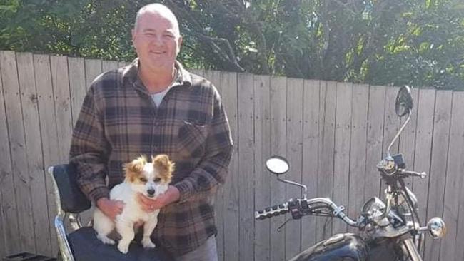 Mark Tozer holding a dog. Picture: File