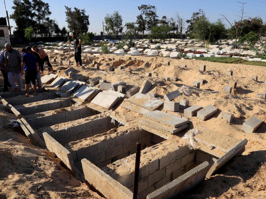 Graves are made ready to receive the new dead in the cemetery in Rafah, south of the Gaza Strip, near the Egyptian border. Picture: AFP