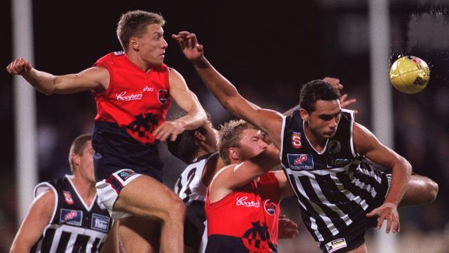 Shaun Burgoyne, front, flies ahead of Norwood players during a 2002 SANFL clash.