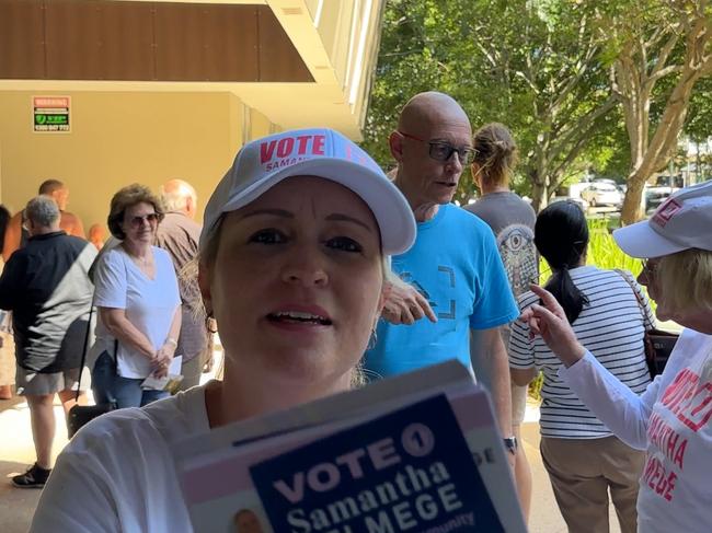 Division 6 Candidate Samantha Delmege smack a reporters recording equipment with her pamphlets. Picture: Mohammad Alfares