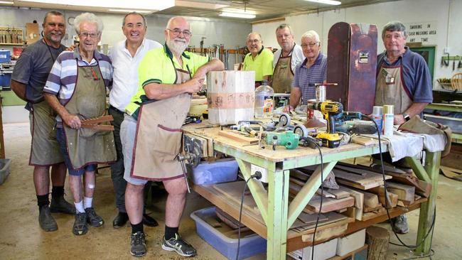 WELCOME RELIEF: Chris Gulaptis with members of the U3A Men's Shed in their workshop. Picture: Debbie Newton