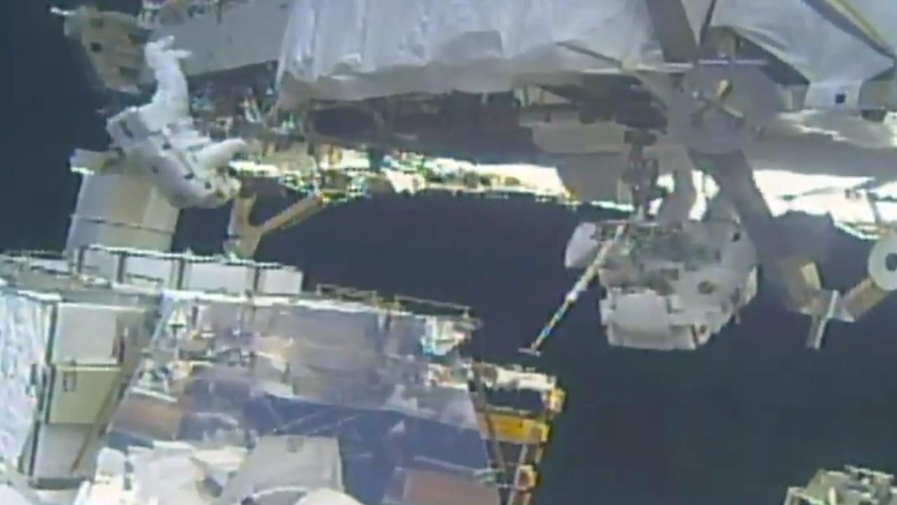 In this image take from NASA video, Koch (left) and Meir (right) install batteries for the International Space Station's solar power grid during a space walk. Picture: NASA via AP