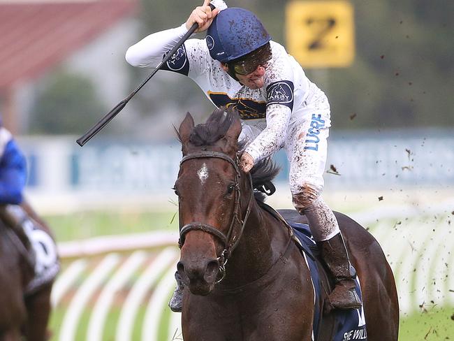 Jockey Ben Melham sticks his tongue out to the crowd as he and She Will Reign take out this year’s Golden Slipper. Picture: AAP