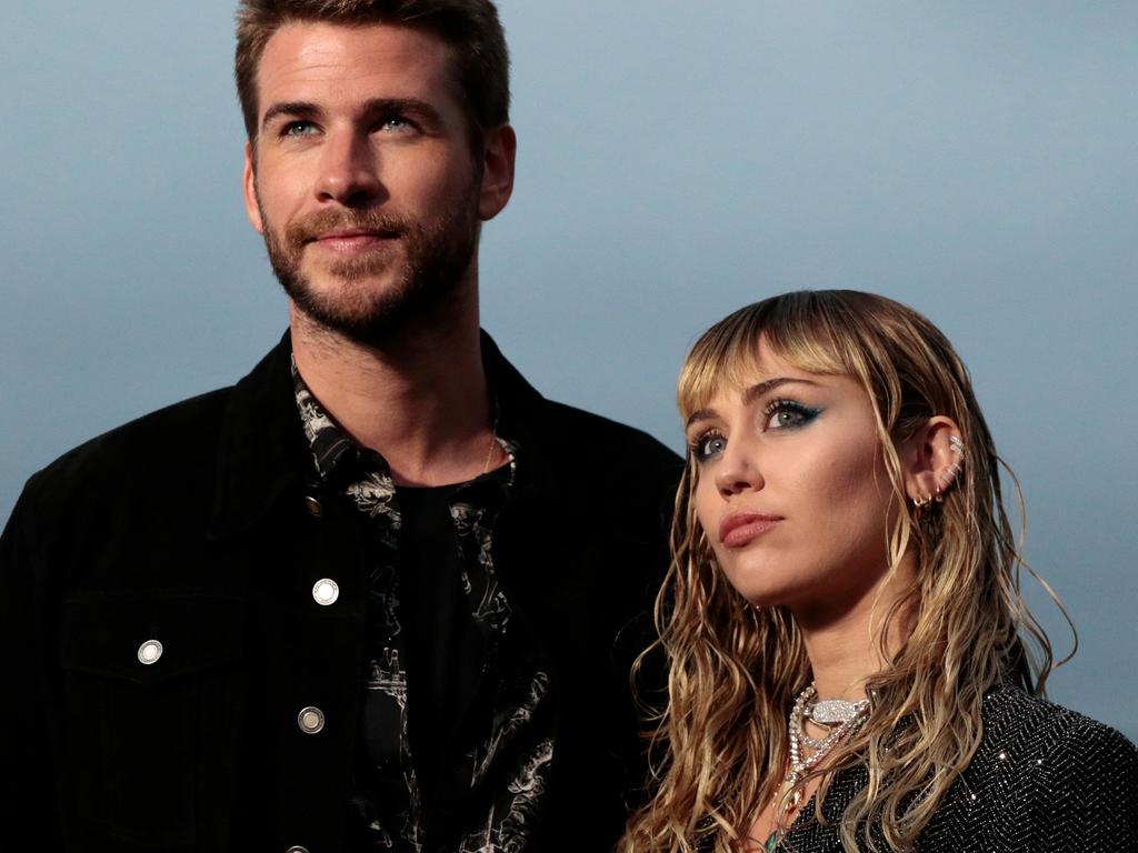 Miley and Liam Hemsworth. Picture: Kyle Grillot/AFP