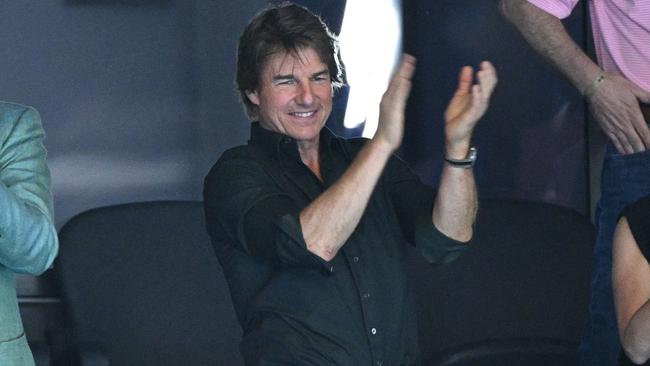 Tom Cruise cheers on the US team at the swimming. Picture: AFP