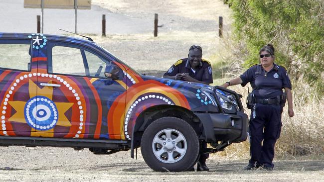 Police outside Redbank Plains High School. Picture: Tertius Pickard