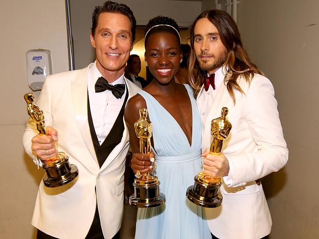 Hot property ... Matthew McConaughey, Lupita Nyong'o and Jared Leto pose with award backstage during the Oscars on March 2.