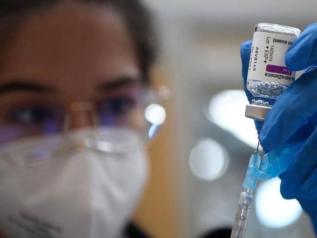 (FILES) In this file photo taken on March 13, 2021 a nurse fills a syringe with the AstraZeneca Covid-19 vaccine during a mass vaccination campaign for people between ages of 50 to 55 in Vigo, northwestern Spain. - Spain said on March 18, 2021 it will resume its Covid-19 inoculation campaign with the AstraZeneca Covid-19 vaccine next week, after the EU's drug regulator deemed the jab "safe and effective". (Photo by MIGUEL RIOPA / AFP)