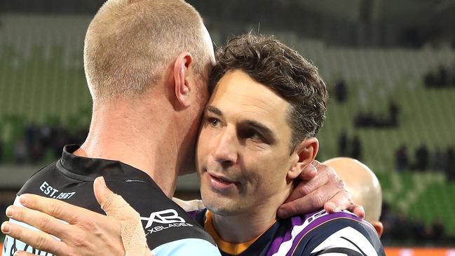 Billy Slater gets a hug from Luke Lewis at the end of Friday’s match. Picture: Getty.