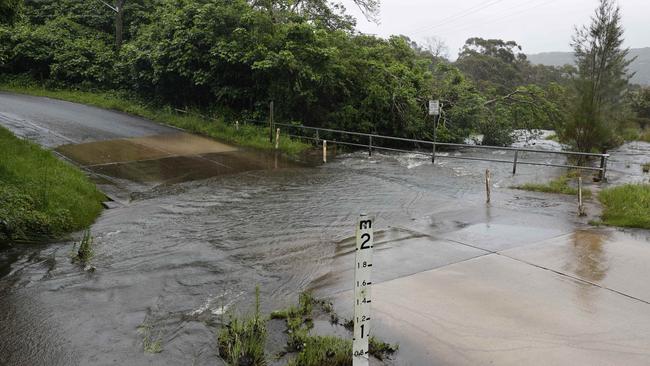 Oxford Falls Rd was closed due to flooding. Picture: Tim Hunter