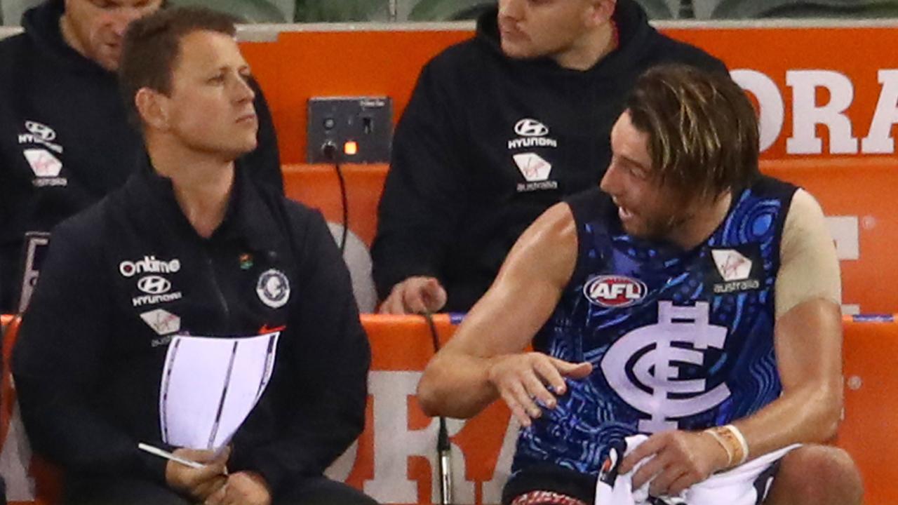 Brendon Bolton talks to Dale Thomas on the Carlton bench. Picture: Getty Images