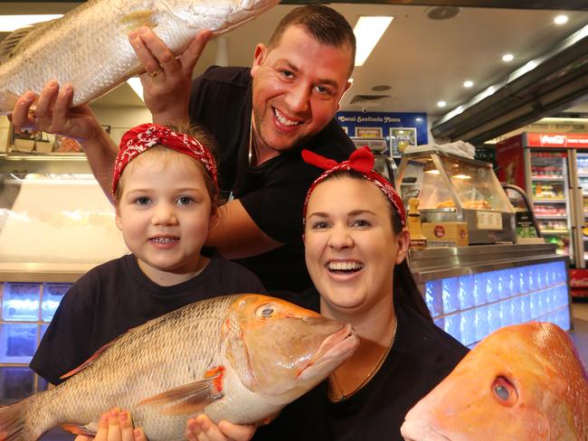 Fresh Coral Seafood owners Platon and Jackie Kaplanidis with their daughter Alexis, 3. Picture Glenn Hampson