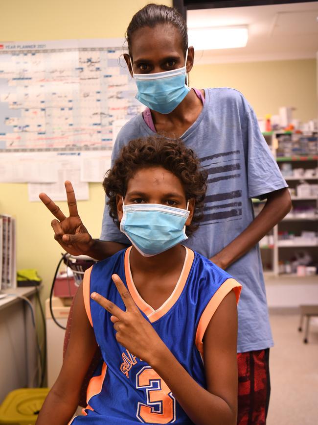 Alwyn Scrubby (12) with mum Alesha Scrubby gets his first vaccination at Sunrise's health clinic in Barunga. Picture: Amanda Parkinson