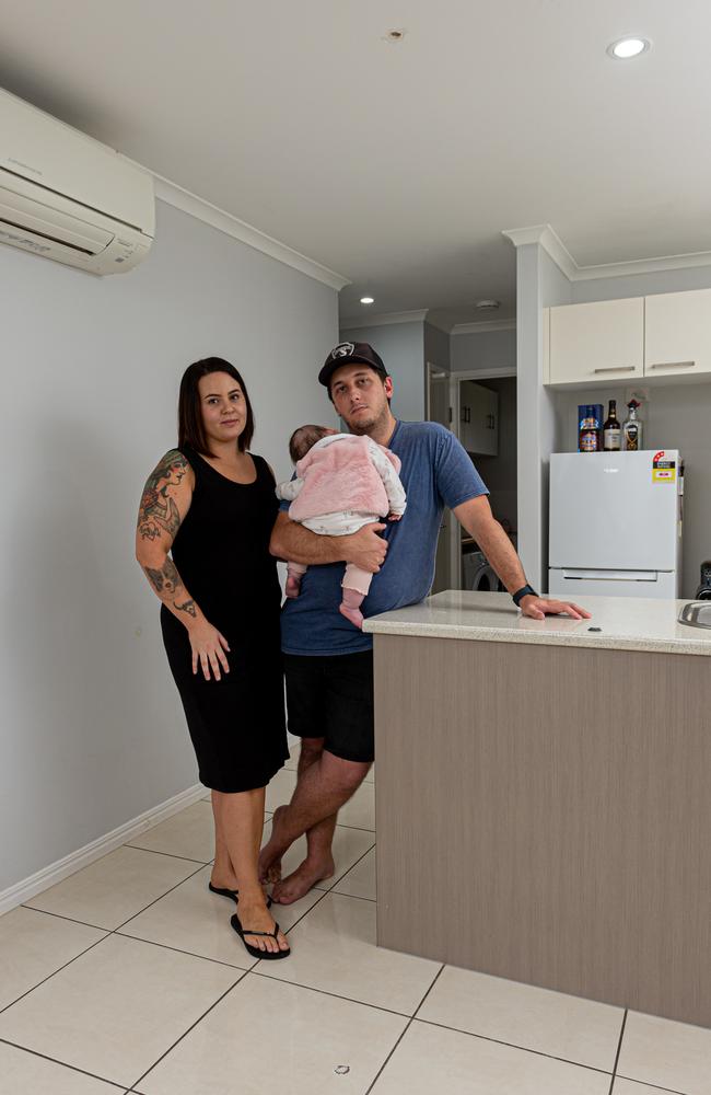 Tenika Lawther and Matthew Gardner with Oceana, standing under the hole in the roof made by The Thing. The damaged tile is near their feet. Picture: Paul Beutel