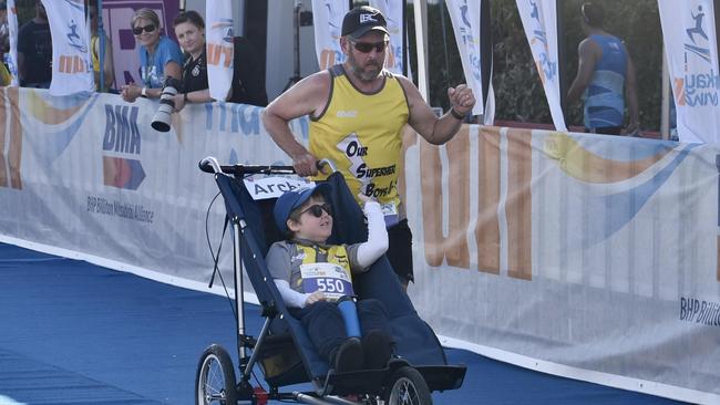 Chris Brigg and Archie Kynaston completing their half marathon. BMA Mackay Marina Run June 5 2022. Picture: Max O'Driscoll.