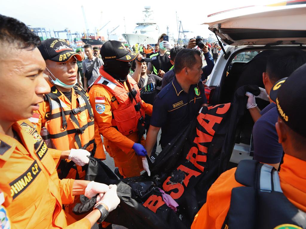 Members of a rescue team transfer body bags into a vehicle at the port in Tanjung Priok, North Jakarta. Picture: AP