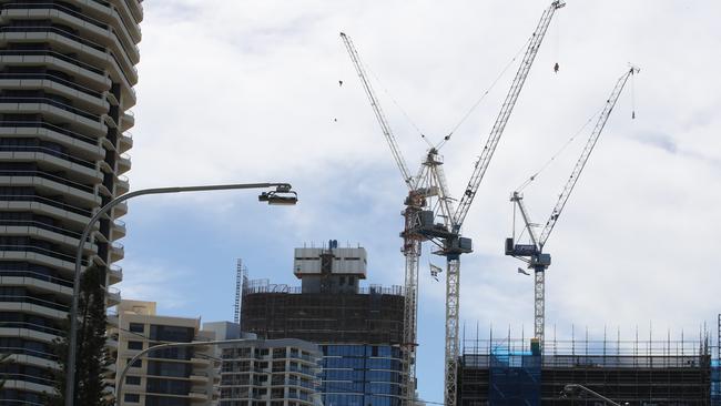 High-rise development, towers and cranes dominate the Main Beach skyline over the Norfolk Pines. Picture Glenn Hampson