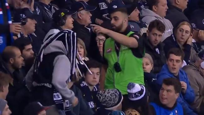 Carlton fans being escorted out by security from Marvel Stadium. Picture: Channel 7