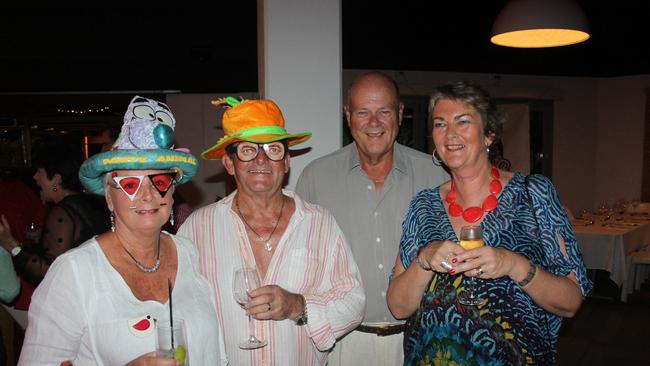 Rhonda and Ken Thackeray pose with Colin and Kerrie Bell at the Variety Bash Saturday night at Airlie Beach Hotel. Photo: Charlotte Lam / Whitsunday Times (30/06/2014)