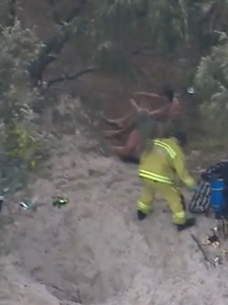 Emergency services and friends raced to rescue him after he became buried in sand on Saturday: Picture: Nine News