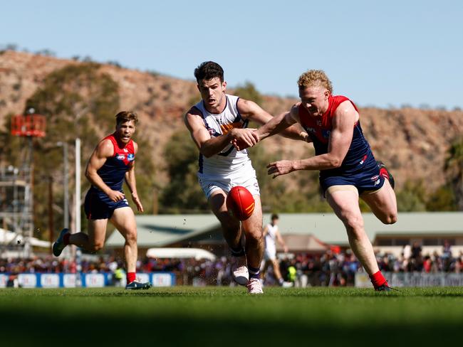 Andrew Brayshaw of the Dockers and Clayton Oliver of the Demons compete for the ball at TIO Traeger Park. Picture: Michael Willson/AFL Photos via Getty Images.