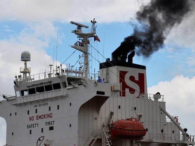 Ship in White Bay Cruise Terminal on the Bays Precinct Discovery Day emitting thick black smoke into Sydney Harbour.