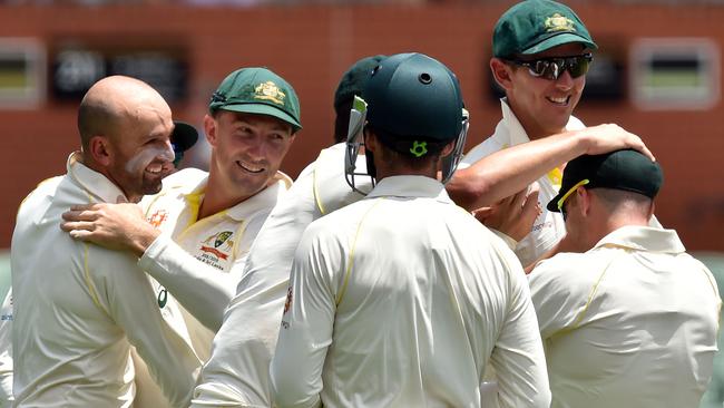 Australia celebrate the wicket of Sharma. Picture: AFP