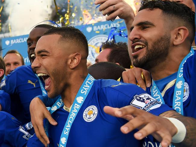 LEICESTER, ENGLAND - MAY 07: Captain Wes Morgan and manager Claudio Ranieri of Leicester City lift the Premier League Trophy after the Barclays Premier League match between Leicester City and Everton at The King Power Stadium on May 7, 2016 in Leicester, United Kingdom. (Photo by Michael Regan/Getty Images)