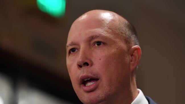 Federal Immigration Minister Peter Dutton speaks to the media about global terrorism prevention in Melbourne, Monday, December 11, 2017. Victoria Police are hosting a three day International Counter Terrorism Forum. (AAP Image/Joe Castro) NO ARCHIVING