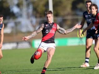 SANFL . South Adelaide v West Adelaide , 28th May 2022 . Hamish Hartlett boots the Bloods forward  . Picture: Cory Sutton / SANFL