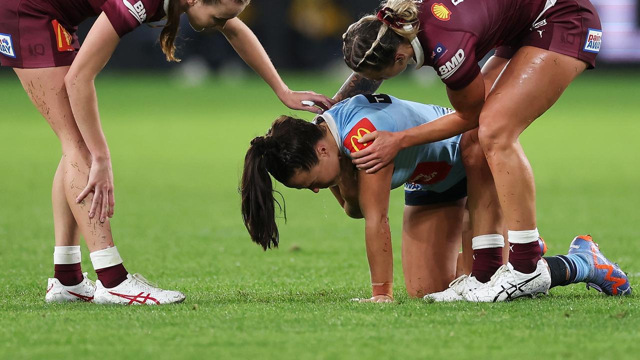 SYDNEY, AUSTRALIA - JUNE 01: Tamika Upton and Julia Robinson of the Maroons check on the injured Isabelle Kelly of the Blues during game one of the Women's State of Origin series between New South Wales and Queensland at CommBank Stadium on June 01, 2023 in Sydney, Australia. (Photo by Mark Kolbe/Getty Images)