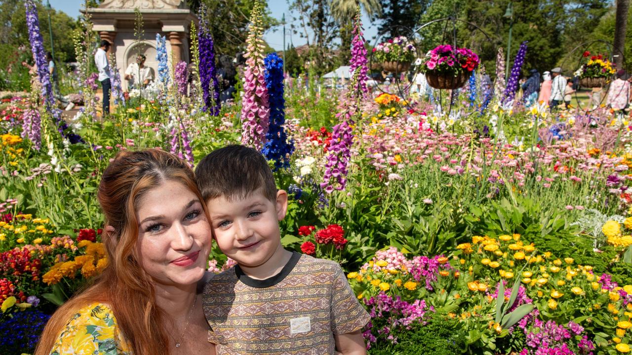 Michaela Cody and her son Raphael Kerr in Botanic Gardens, Queens Park during the Carnival of Flowers, Sunday, September 22, 2024. Picture: Bev Lacey