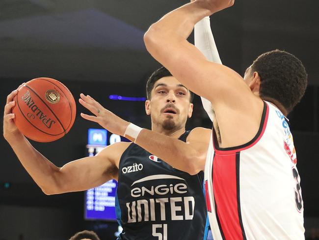 MELBOURNE, AUSTRALIA - MARCH 12: Shea Ili of United drives to the basket under pressure from Trey Kell III of the Hawks during game two of the NBL Grand Final Series between Melbourne United and Illawarra Hawks at John Cain Arena, on March 12, 2025, in Melbourne, Australia. (Photo by Daniel Pockett/Getty Images)