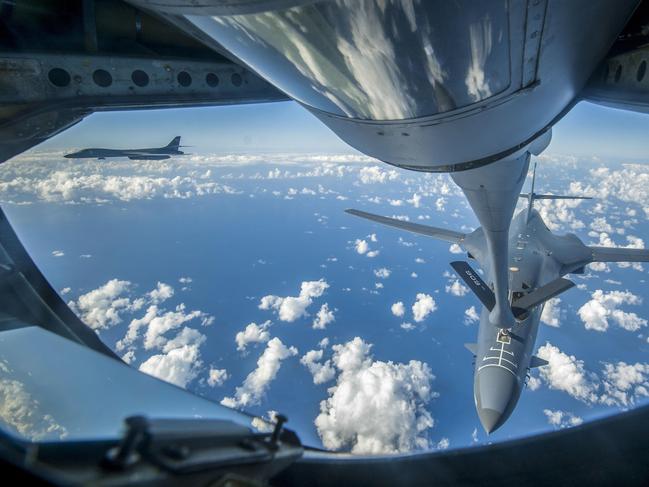 This US Air Force handout photo obtained September 23, 2017 shows an Air Force B-1B Lancer receiving fuel from a KC-135 Stratotanker near the East China Sea, on September 18, 2017.  US bombers accompanied by fighter jets flew off the east coast of North Korea on September 23, 2017 in a show of force designed to project American military power in the face of Pyongyang's weapons programs, the Pentagon said. It was the furthest north of the Demilitarized Zone (DMZ) any US fighter or bomber aircraft have flown off North Korea's coast in this century, Pentagon spokesman Dana White said.   / AFP PHOTO / US AIR FORCE / Peter REFT / RESTRICTED TO EDITORIAL USE - MANDATORY CREDIT "AFP PHOTO / US AAIR FORCE/PETER REFT/HANDOUT" - NO MARKETING NO ADVERTISING CAMPAIGNS - DISTRIBUTED AS A SERVICE TO CLIENTS