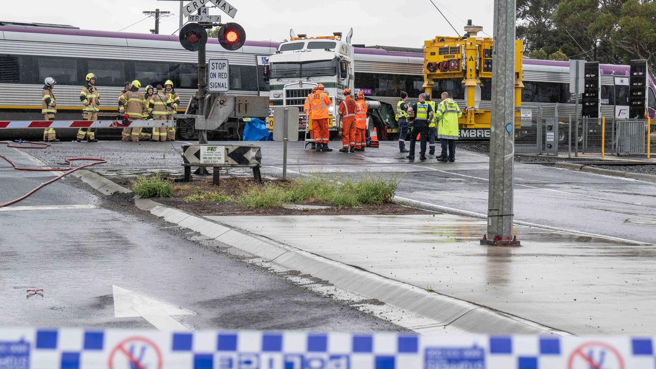 Emergency services at the scene of a fatal collision at a level crossing in North Shore. Picture: Brad Fleet