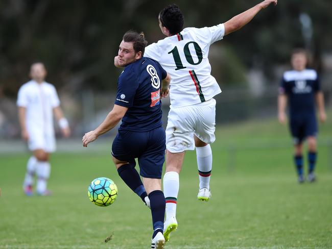 Croydon City Arrows (in white) match up against Mazenod United at Croydon in April. Picture: Steve Tanner