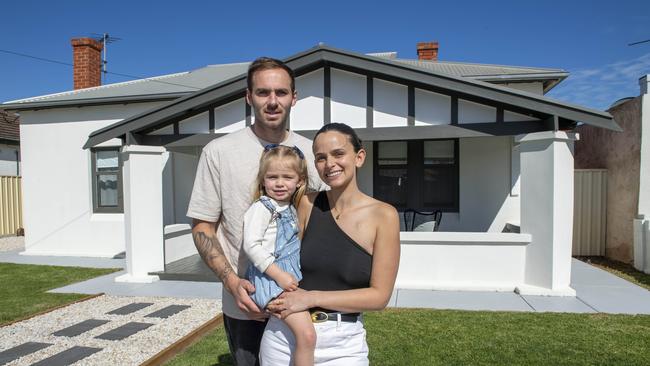 Kellie and Jeremy Finlayson with their daughter Sophia, 3, at their Hendon home, which is going to auction on September.