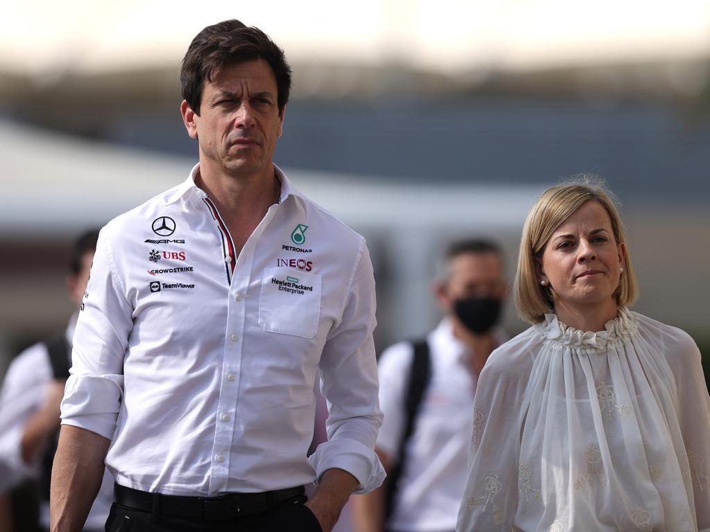 Mercedes GP Executive Director Toto Wolff walks in the Paddock with his wife Susie Wolff. (Photo by Lars Baron/Getty Images)