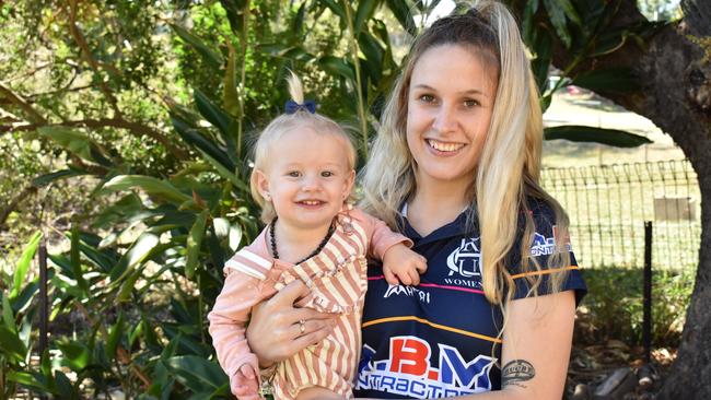 Jess Allen, who was revived on the sideline of a Gladstone rugby union field after a cardiac arrest, with daughter Amanii.