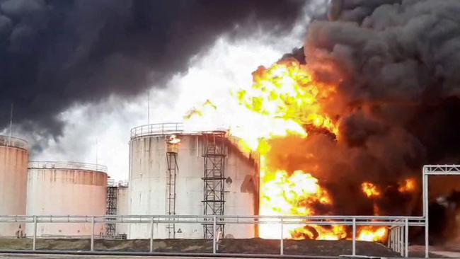 Firemen working to extinguish a fire at a Rosneft fuel depot in the town of Belgorod, some 40 kilometres from Russia's border with Ukraine. Picture: AFP.