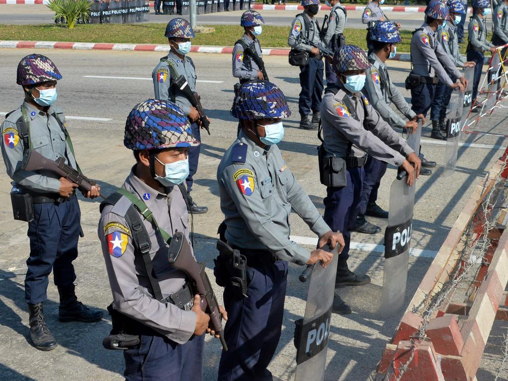 Police stand guard along a road in Naypyidaw on January 29, 2021, ahead of the reopening of the parliament on February 1. Picture: Thet Aung/AFP