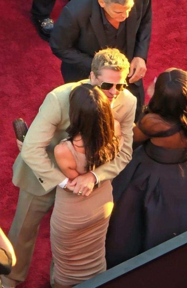 Pitt says goodbye to Ramon with an awkward hug before he joins pal Clooney for red carpet duties. Picture: Splash/Backgrid