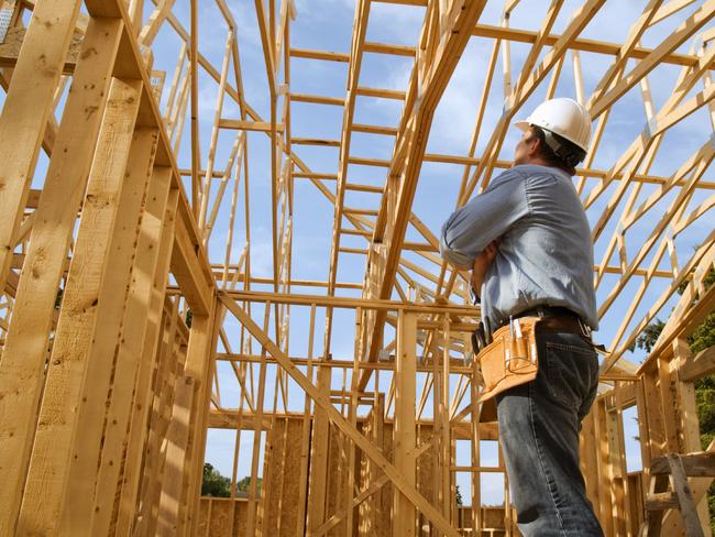 generic pic of builder inside new house under construction