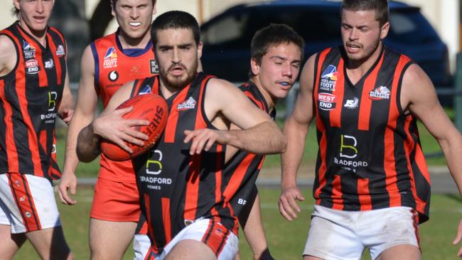 Action from the division three Adelaide Footy League clash between Plympton and Flinders Park last season. Picture: AAP/Brenton Edwards