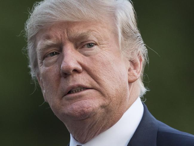 FILE - In this Aug. 23, 2017 file photo, President Donald Trump walks on the South Lawn of the White House in Washington. The president lashed out at Republican leaders in Congress, suggesting efforts to increase the country's borrowing limit to avoid an economic-rattling default on the nation's debt are "a mess!" (AP Photo/Carolyn Kaster)