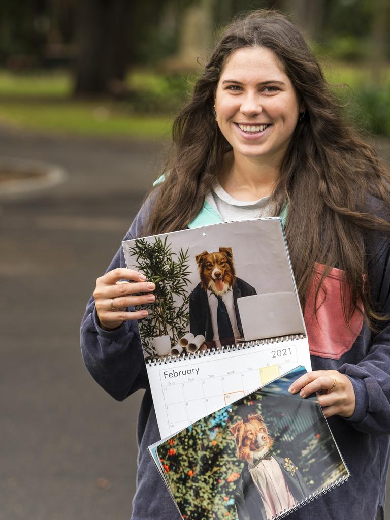 Darby Brown with the 2021 calendar featuring Australian Shepherd Austin. Pictures: Kevin Farmer.